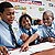 From left to right: Rodney Thomas, Tyreke Johnson, Malik Harris. Boys at Burroughs Education Center in Washington, DC look at their payment vouchers.